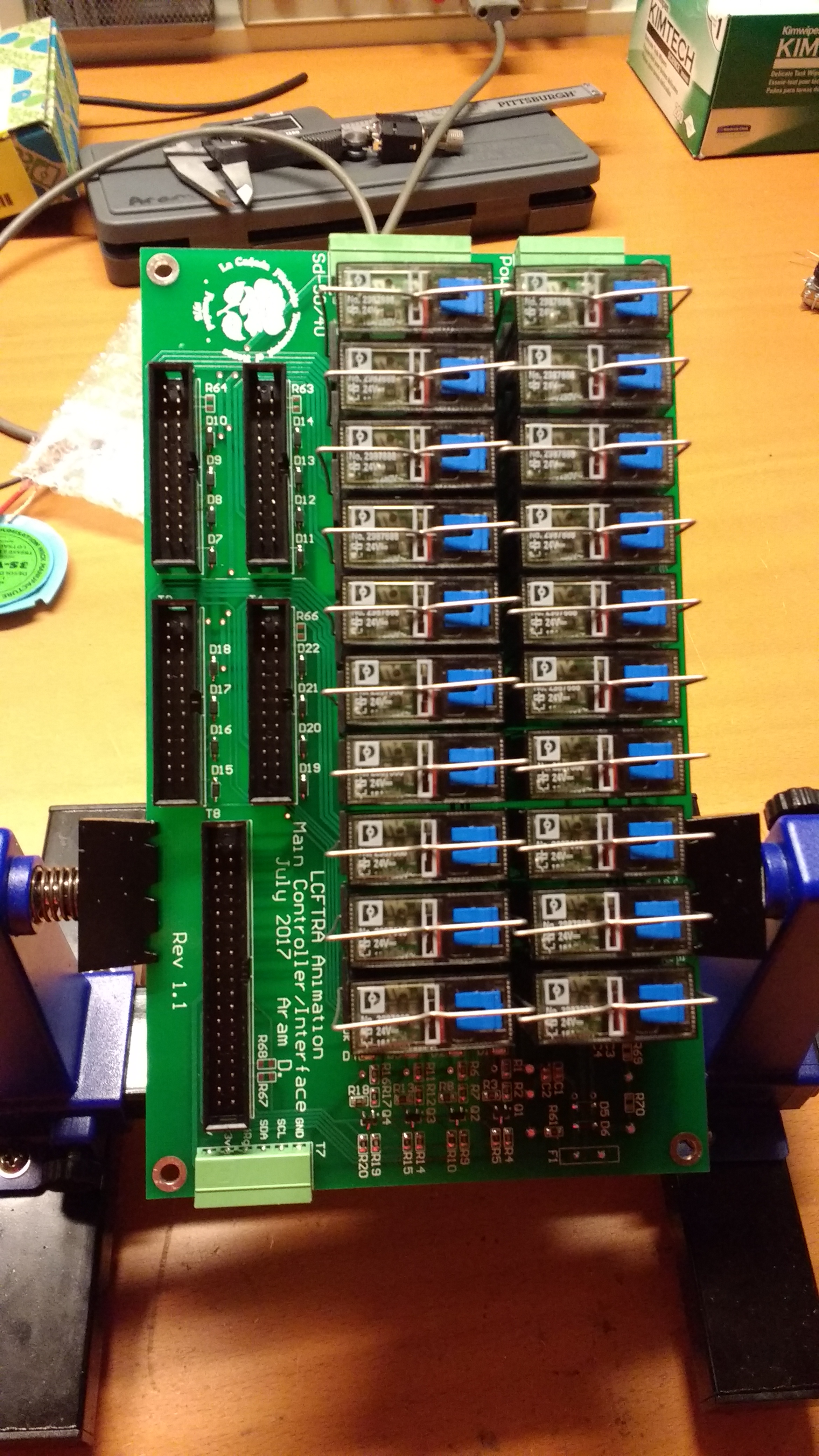 The assembled controller PCB in an assembly stand